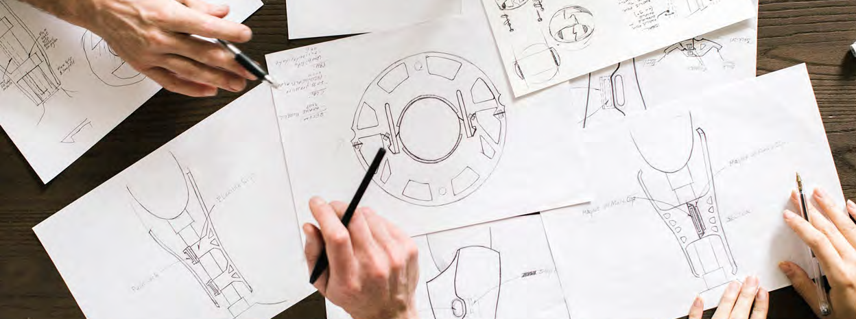 team working on paper designs