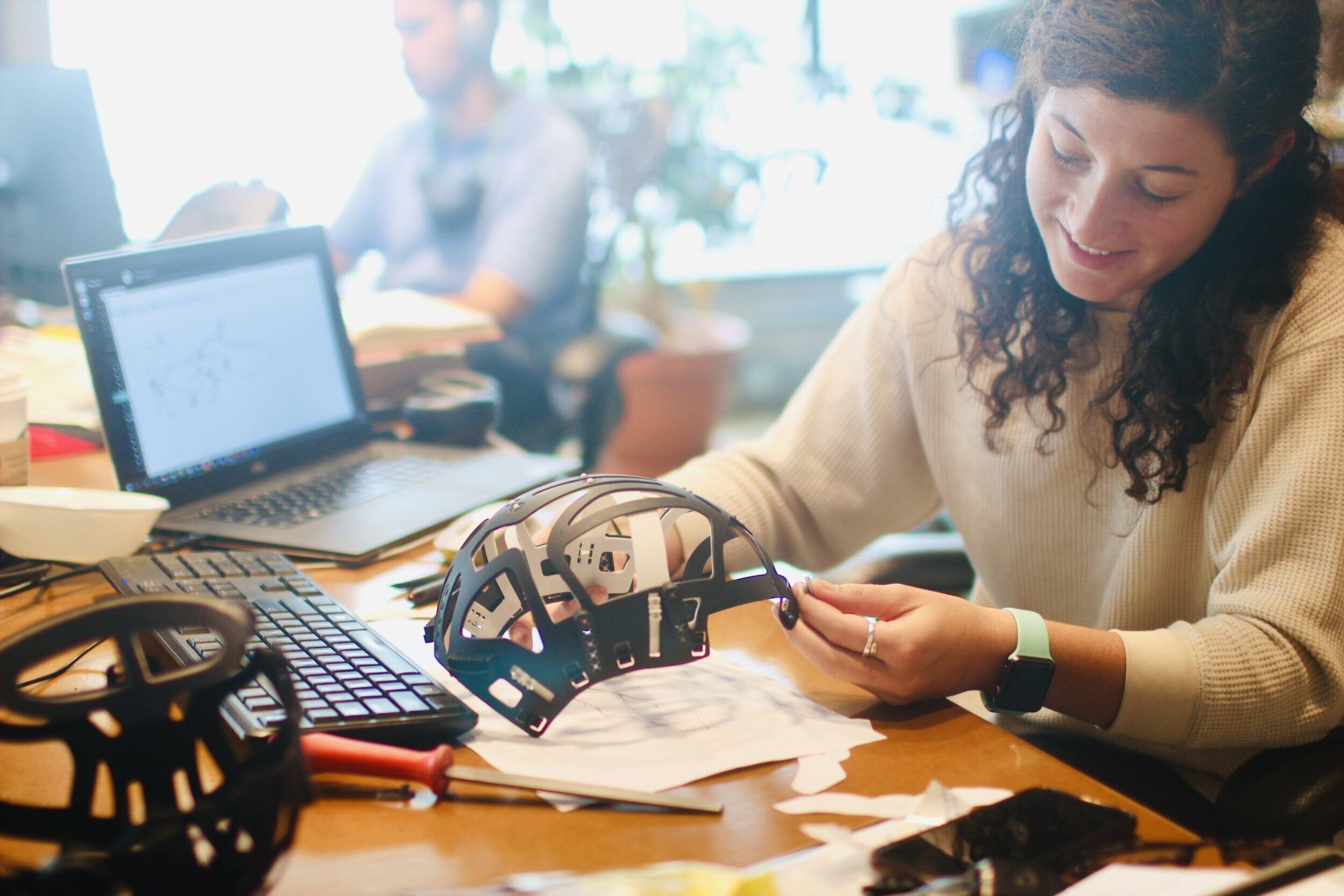 Designer with product prototype